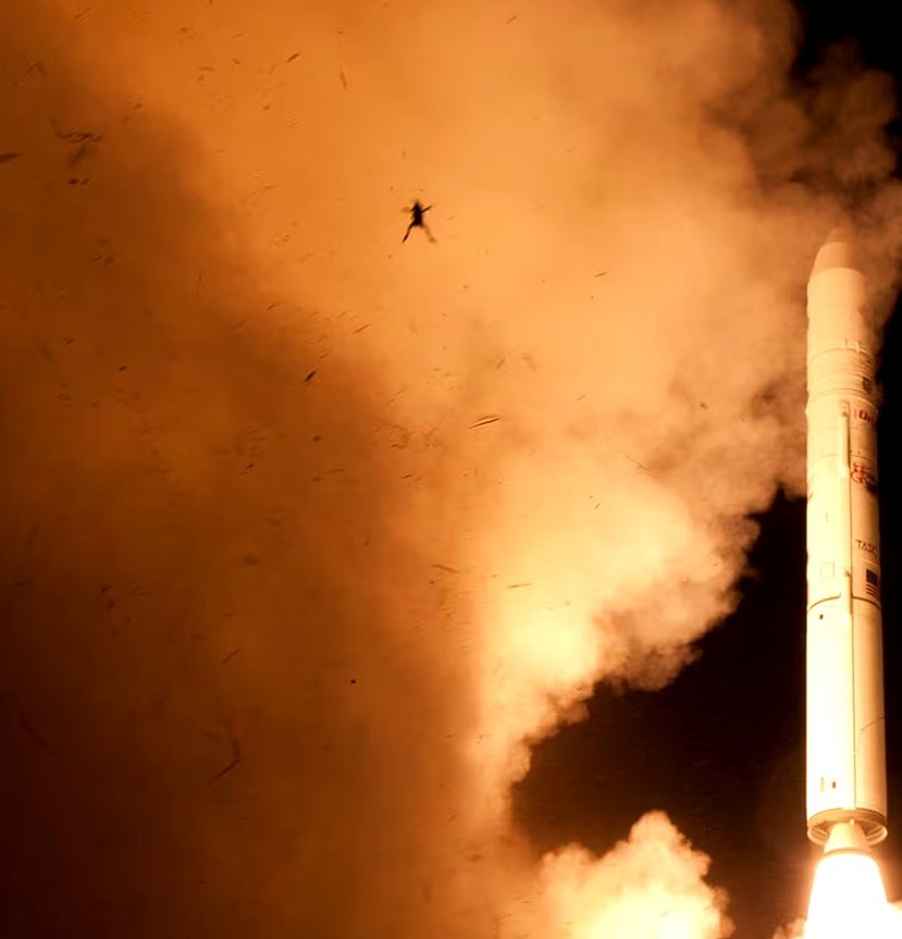 Frog airborne in front of the rocket's plume at the Wallops Flight Facility in Virginia