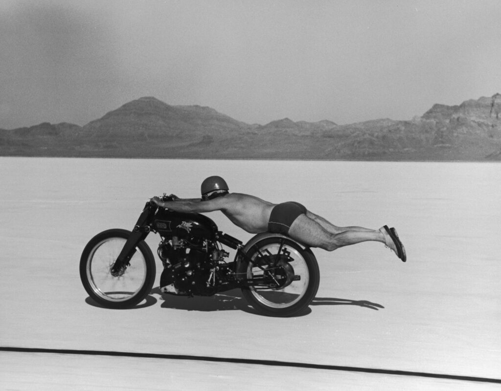 Rollie Free, laying horizontally on his bike to reduce wind resistance, broke the world’s speed record for a motorcycle at the Bonneville Salt Flats in Utah, September 13, 1948